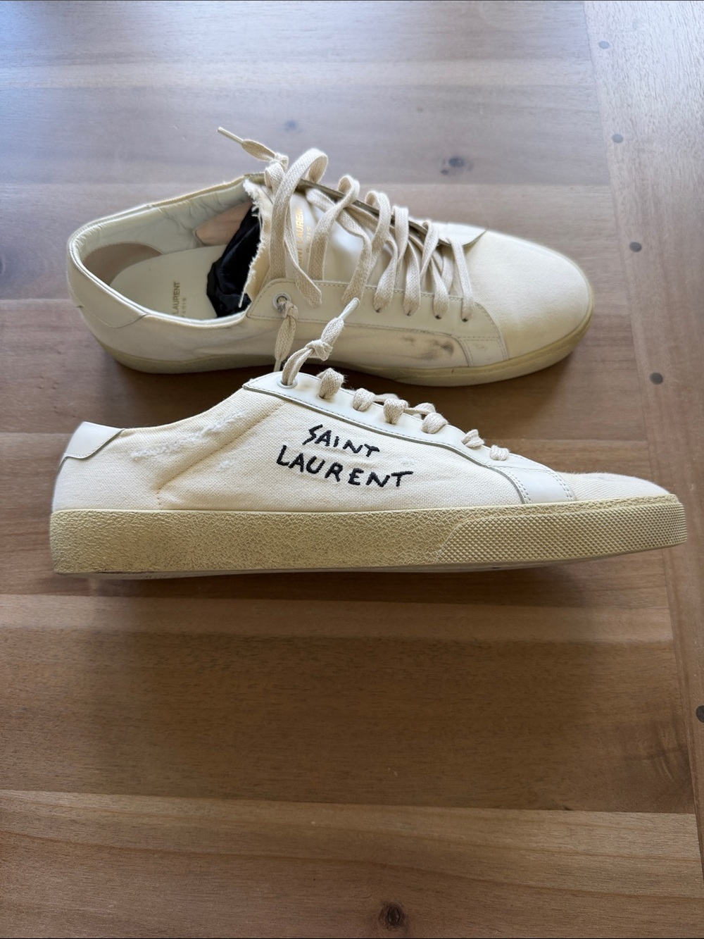 Saint Laurent Men’s Low-Top Canvas Sneakers in Cream with Black Script